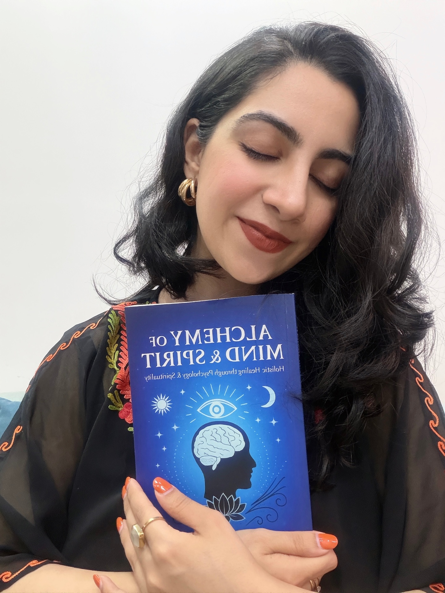 Dr. Vasudha with her book Alchemy of Mind & Spirit